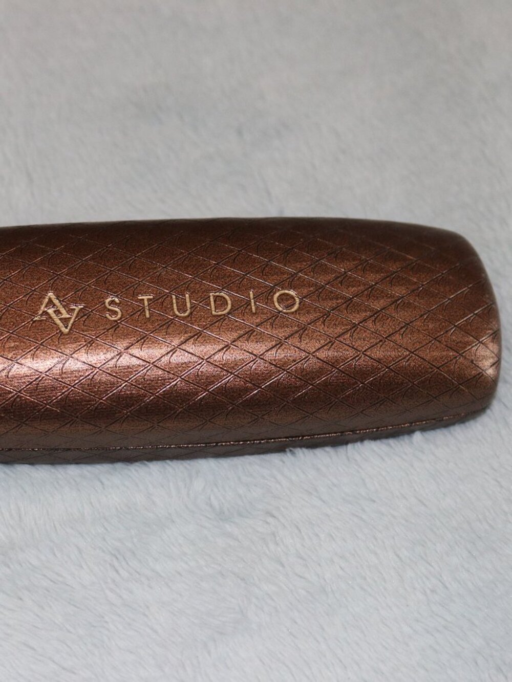 Brown eyeglass case. AV Studio.